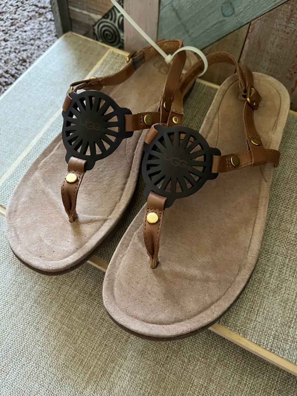UGG Brown Leather T-Strap Sandals with Black Medallion